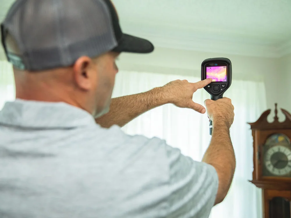 Puffin Mechanical Technician using the Infrared camera during the Home Performance Test